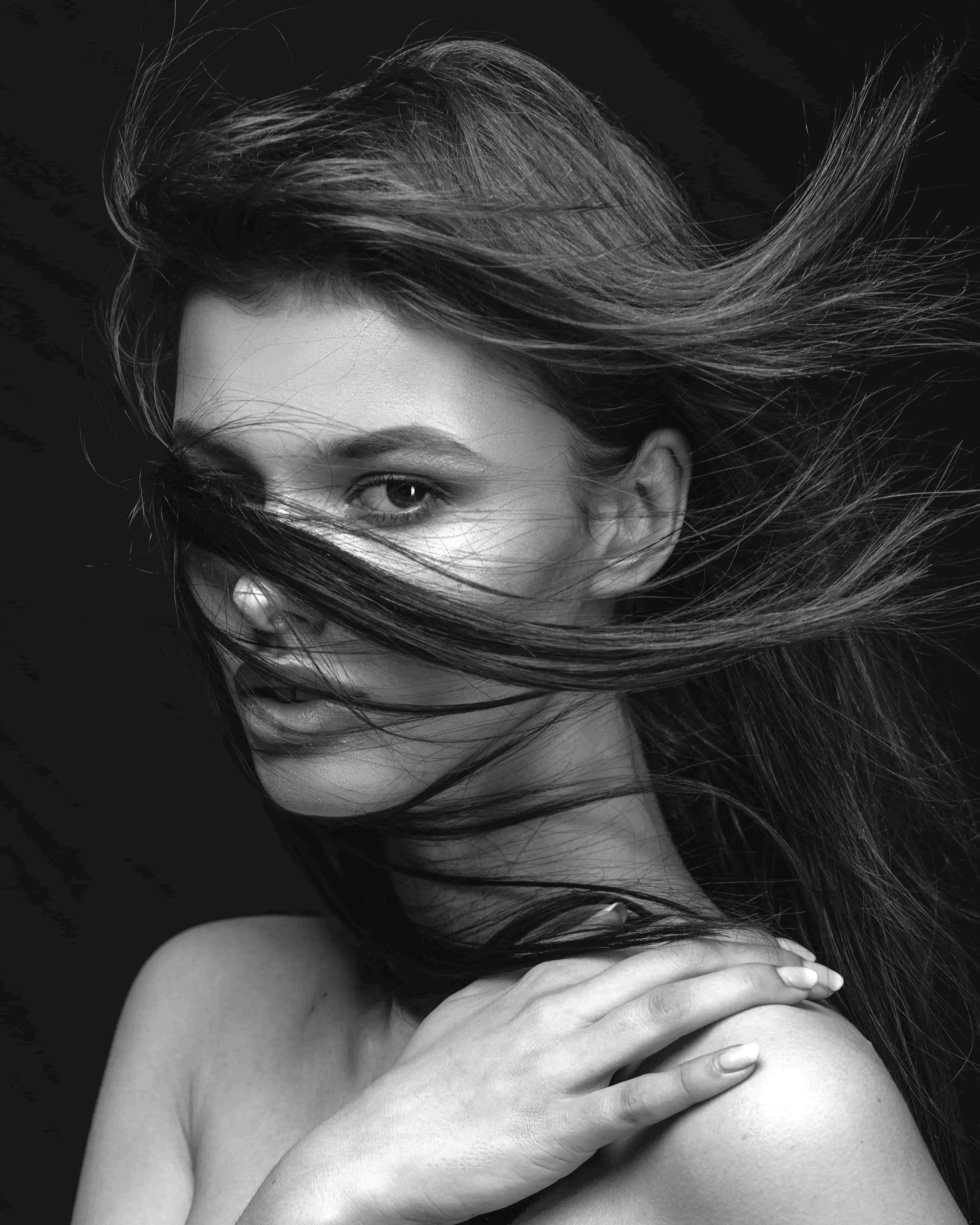 Portrait with hair veiling the face